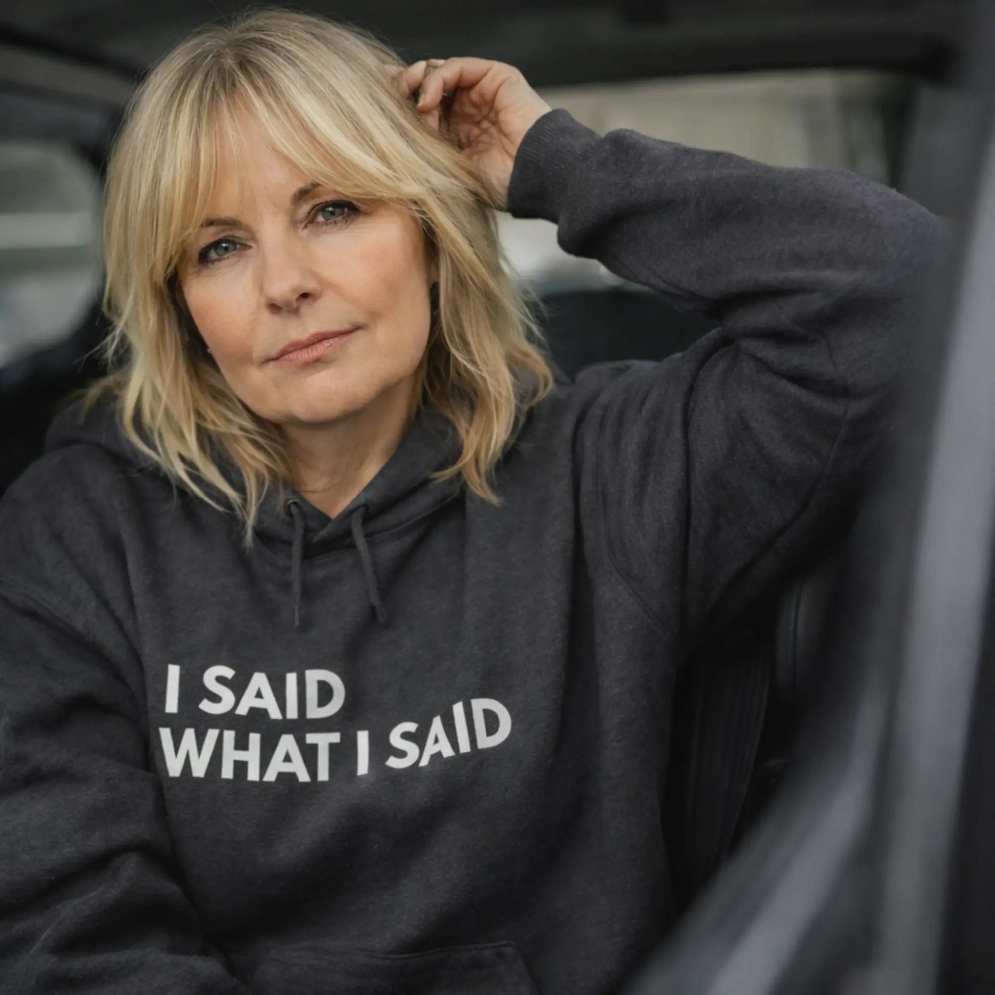 UK woman wearing dark heather slogan hoodie “I said what I said” close up