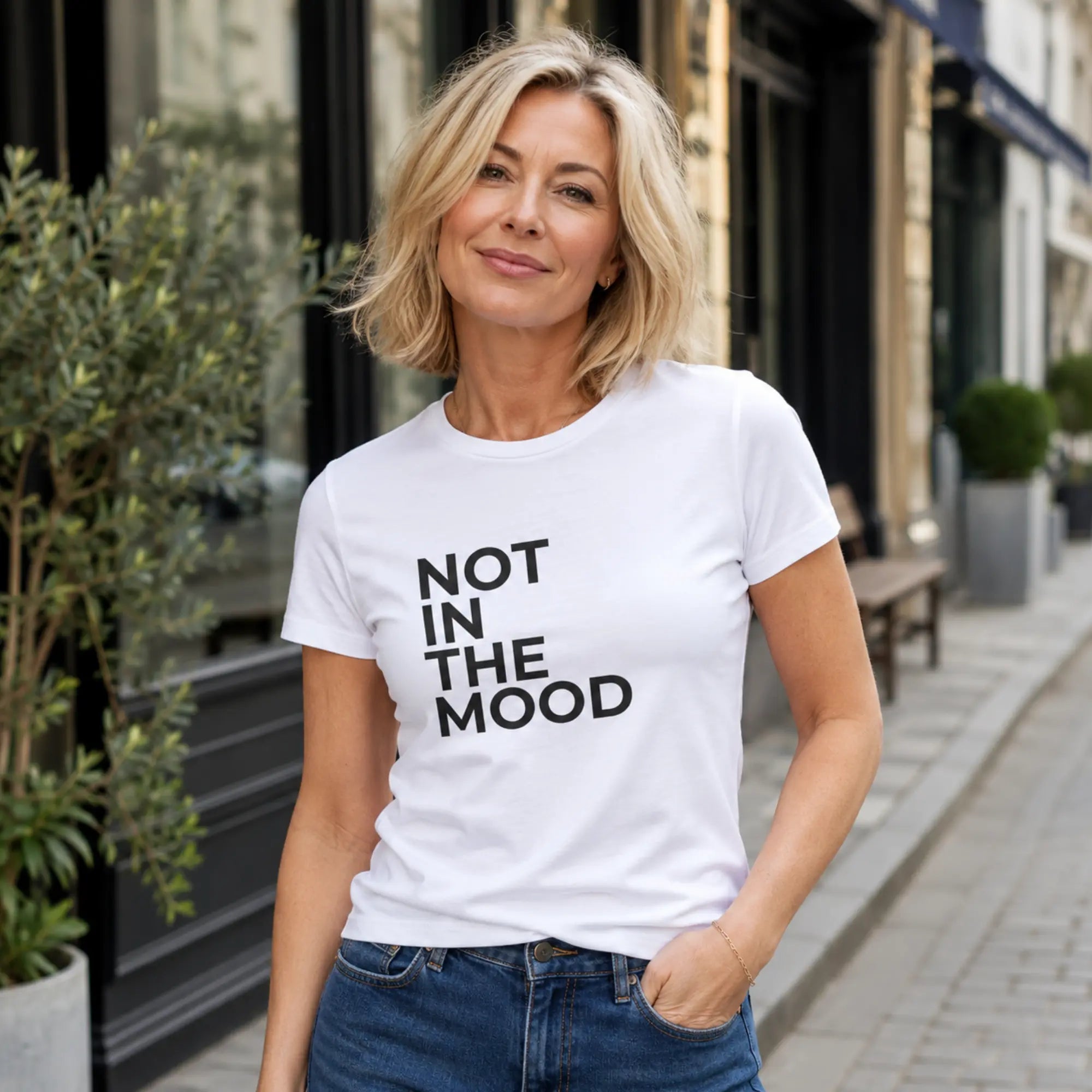 Woman wearing Not In The Mood white t-shirt on a British high street