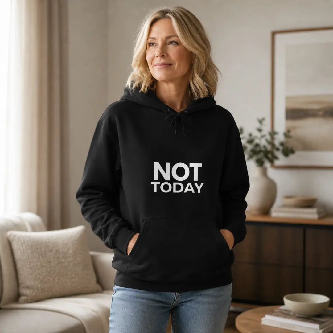 Blonde woman wearing black Not Today hoodie at home